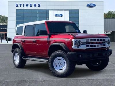 2026 Ford Bronco Heritage Edition in Ruby Red Metallic Tinted Clearcoat — front three-quarter view