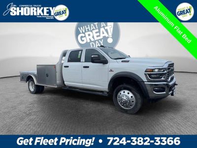 2026 RAM 5500 Tradesman DRW 4x4 / 6.7L Diesel / 11' Aluminum Flatbed in Bright White Clear-Coat Exterior Paint — front three-quarter view