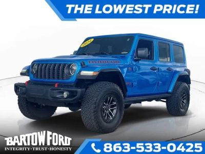 2024 Jeep Wrangler Rubicon X in Blue Pearl — front three-quarter view