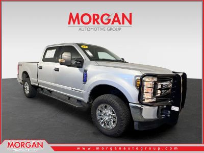 2019 Ford F-250SD XLT in Ingot Silver Metallic — front three-quarter view