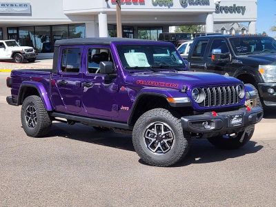 2026 Jeep Gladiator GLADIATOR RUBICON 4X4 in Reign Exterior Paint — front three-quarter view