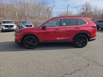 2024 Honda CR-V Hybrid Sport Touring — rear three-quarter view