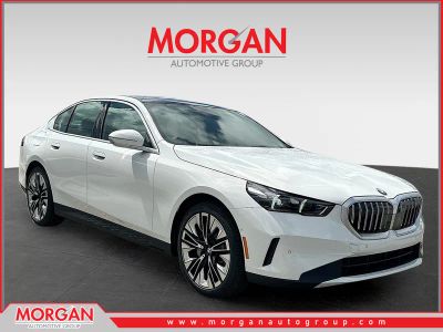 2026 BMW 5 Series 530i in Alpine White — front three-quarter view
