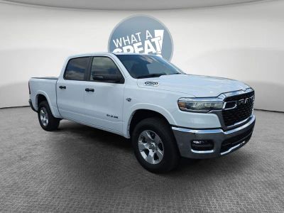 2026 RAM 1500 Big Horn/Lone Star in Bright White Clearcoat — front three-quarter view