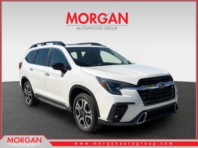 2025 Subaru Ascent Touring in Crystal White Pearl — front three-quarter view