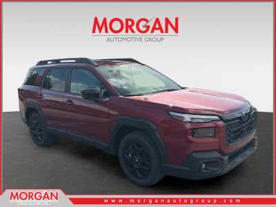 2026 Subaru Outback Limited in Crimson Red Pearl — front three-quarter view