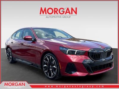 2027 BMW 5 Series 530i in Vegas Red Metallic — front three-quarter view