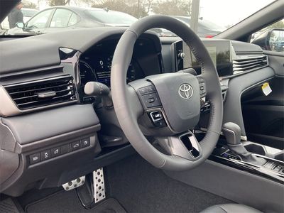 2026 Toyota Camry XSE in Supersonic Red Wit — front three-quarter view