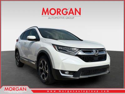 2019 Honda CR-V Touring in White — front three-quarter view