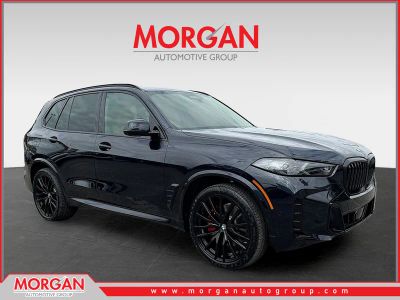 2026 BMW X5 xDrive40i in CARBON BLK MET — front three-quarter view