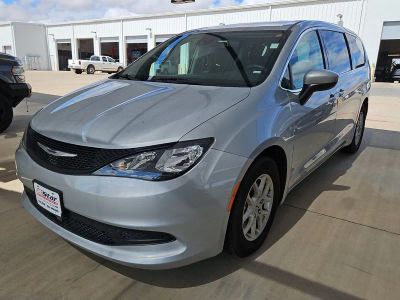 2023 Chrysler Voyager LX in Silver Mist Clearcoat — front three-quarter view