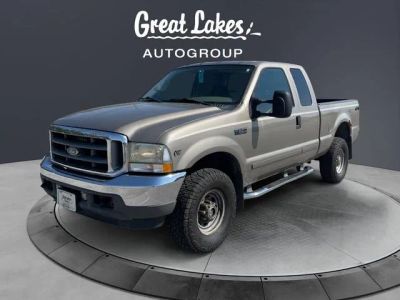 2002 Ford F-350SD XLT in Arizona Beige Clearcoat Metallic — front three-quarter view