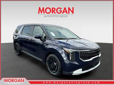 2026 Kia Carnival LXS in Blue — front three-quarter view