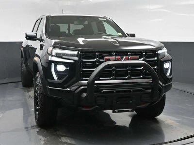 2026 GMC Canyon AT4 in Onyx Black — front three-quarter view