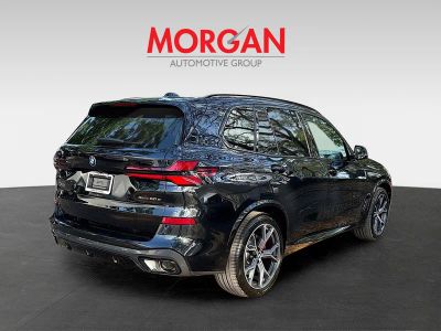 2026 BMW X5 — rear three-quarter view