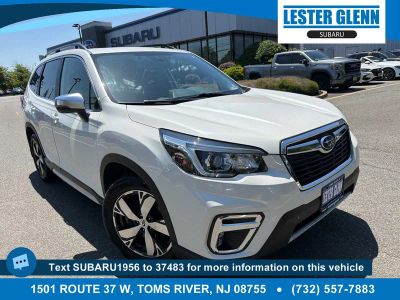 2020 Subaru Forester Touring in Crystal White Pearl — front three-quarter view