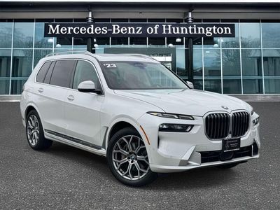 2023 BMW X7 xDrive40i in White Metallic — front three-quarter view