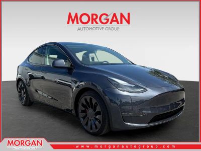 2025 Tesla Model Y Performance in Stealth Grey — front three-quarter view