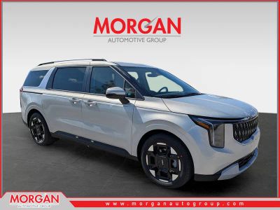2026 Kia Carnival EX in Ivory Silver — front three-quarter view