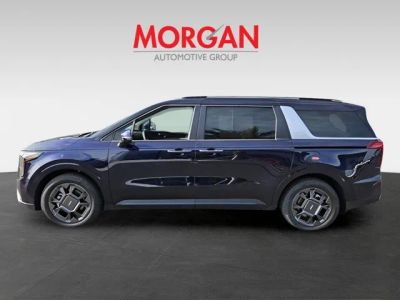 2026 Kia Carnival Hybrid — rear three-quarter view