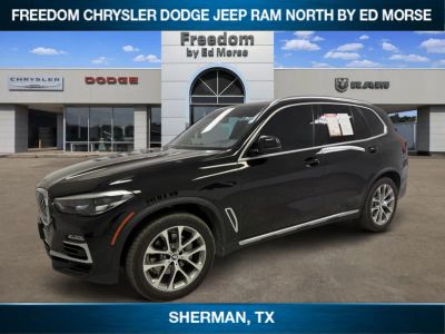 2019 BMW X5 xDrive40i in Jet Black — front three-quarter view
