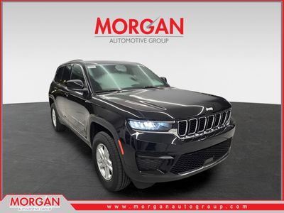 2025 Jeep Grand Cherokee Laredo in Diamond Black Crystal Pearlcoat — front three-quarter view