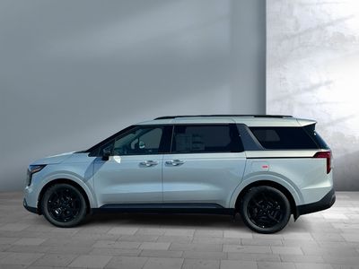 2026 Kia Carnival — rear three-quarter view