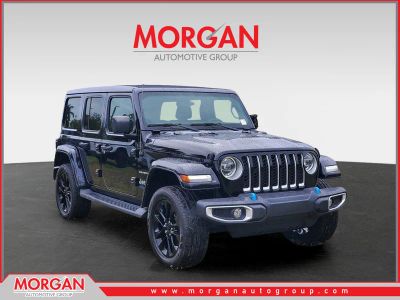 2022 Jeep Wrangler 4xe Unlimited Sahara in Black Clearcoat — front three-quarter view