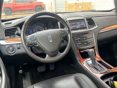 2014 Lincoln MKS — rear three-quarter view