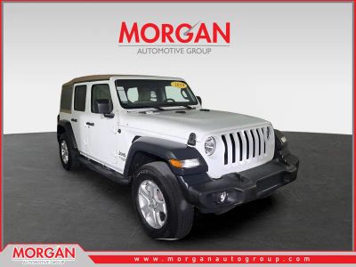 2019 Jeep Wrangler Unlimited Sport S in White — front three-quarter view