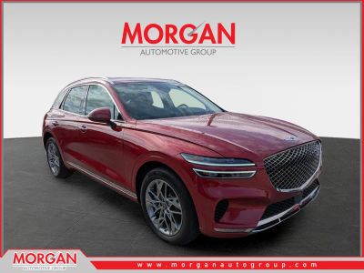 2025 Genesis GV70 2.5T in Mauna Red — front three-quarter view