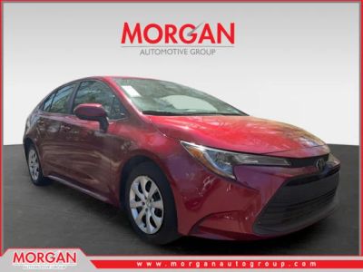 2024 Toyota Corolla LE in Red — front three-quarter view