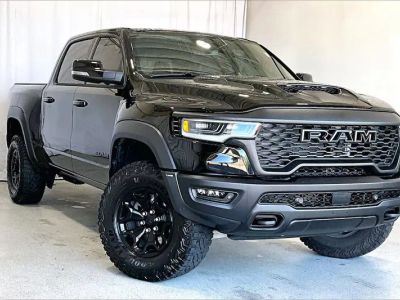 2026 Ram 1500 in Diamond Black Crystal Pearlcoat — front three-quarter view