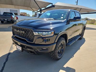 2026 RAM 1500 Rebel in Diamond Black Crystal Pearlcoat — front three-quarter view
