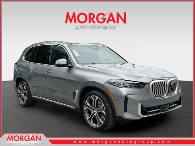 2026 BMW X5 xDrive50e in Skyscraper Grey Metallic — front three-quarter view