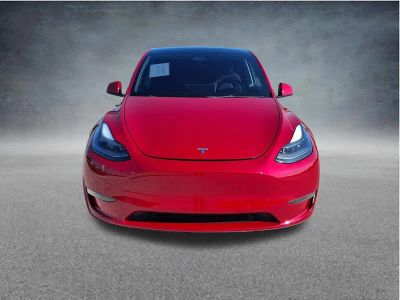 2021 Tesla Model Y Performance in Red Multi-Coat — front three-quarter view