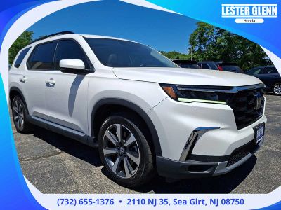 2025 Honda Pilot Touring in Platinum White Pearl — front three-quarter view