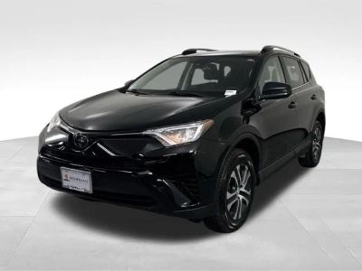 2017 Toyota RAV4 LE in Black — front three-quarter view
