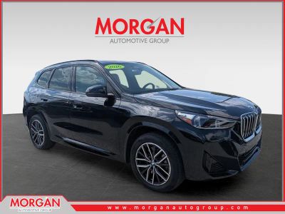 2026 BMW X1 xDrive28i in Black Sapphire Metallic — front three-quarter view
