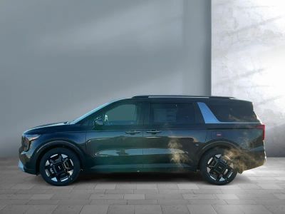 2026 Kia Carnival — rear three-quarter view