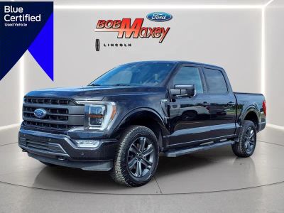 2023 Ford F-150 Lariat in Agate Black Um — front three-quarter view