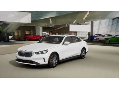 2027 BMW 5 Series 530i xDrive in Alpine White — front three-quarter view