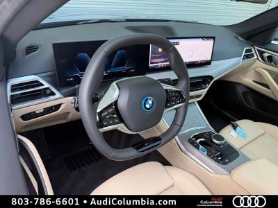 2025 BMW i4 — rear three-quarter view
