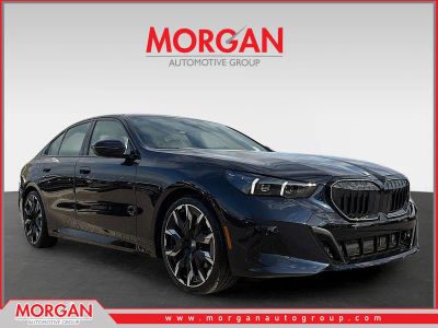 2026 BMW 5 Series 530i in Carbon Black Metallic — front three-quarter view