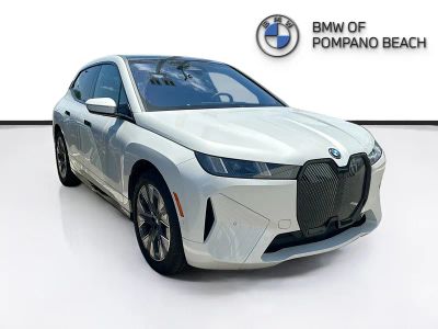 2026 BMW iX xDrive45 in Mineral White Metallic — front three-quarter view