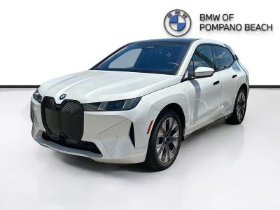 2026 BMW iX — rear three-quarter view