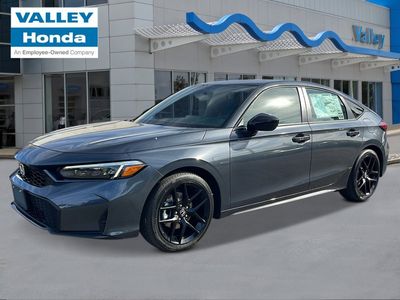 2026 Honda Civic Hatchback Hybrid Sport in Meteorite Gray Metallic — front three-quarter view