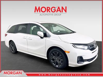 2026 Honda Odyssey Touring in White — front three-quarter view