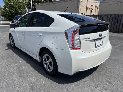 2013 Toyota Prius — rear three-quarter view