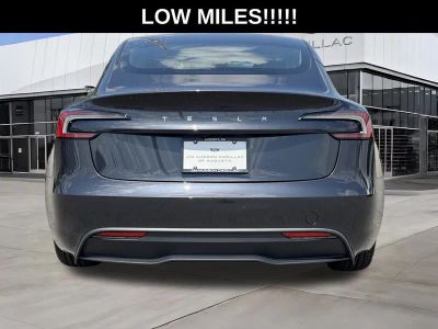 2025 Tesla Model 3 — rear three-quarter view